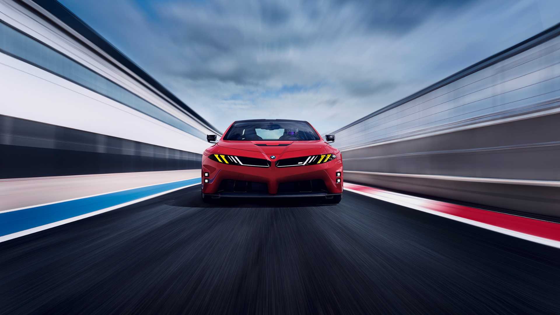 BMW M Neue Klasse vermelho em vista frontal em alta velocidade em circuito de corrida